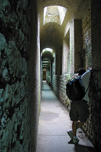 photographer using a wall to brace the camera