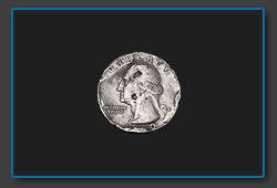 снимок монеты крупным планом с увеличением 0.5X